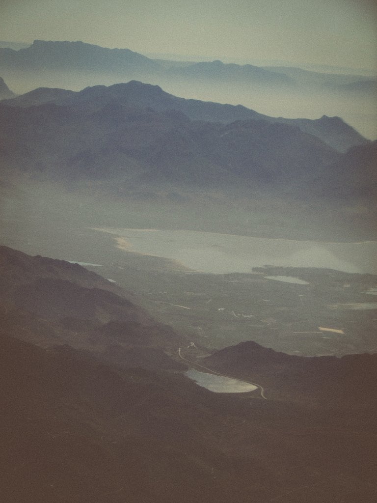 Layered blue ridges fading into haze