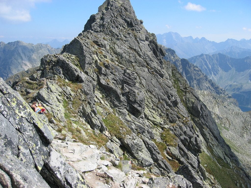 A sharp rocky ridge climbing toward a summit