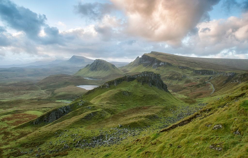 Green hills under heavy clouds